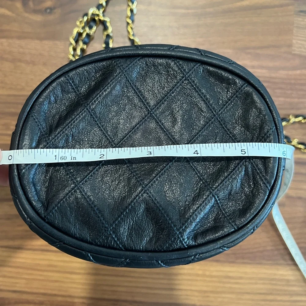 CHANEL Black Quilted Leather Drawstring Bucket Bag with Gold Hardware